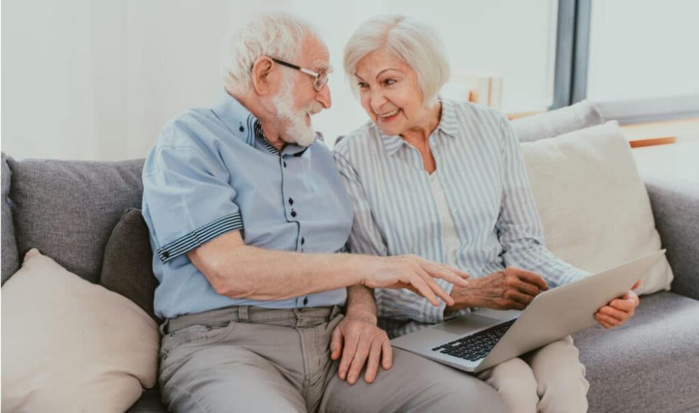 Basic Tech By Inventiva Creative Studio Older Couple Looking At Laptop
