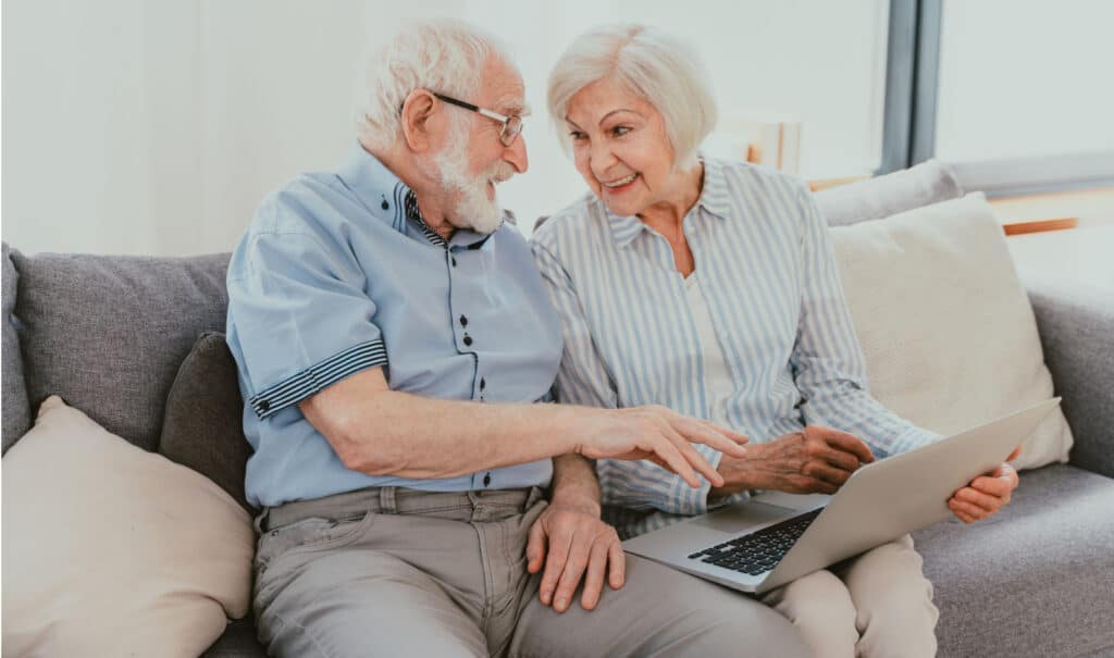 Basic Tech By Inventiva Creative Studio Older Couple Looking At Laptop